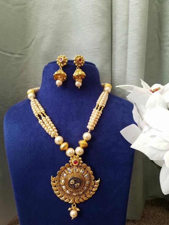 Check out this item in my Etsy shop https://www.etsy.com/listing/715776379/gold-necklace-pendants-necklace Gold Kundan Earrings For Marriage, Traditional Gold Jhumkas For Marriage, Temple Jewelry Jhumkas For Marriage And Festivals, Festive Gold Jhumkas For Marriage, Gold Jhumkas For Marriage And Festive Occasions, Temple Style Jhumkas For Marriage And Festivals, Gold Chandbali Jhumkas For Marriage, Gold Heavy Jhumkas For Marriage, Festive Chandbali Jhumkas For Marriage