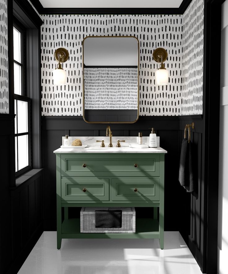 a bathroom with black and white wallpaper, green vanity and gold accents on the mirror