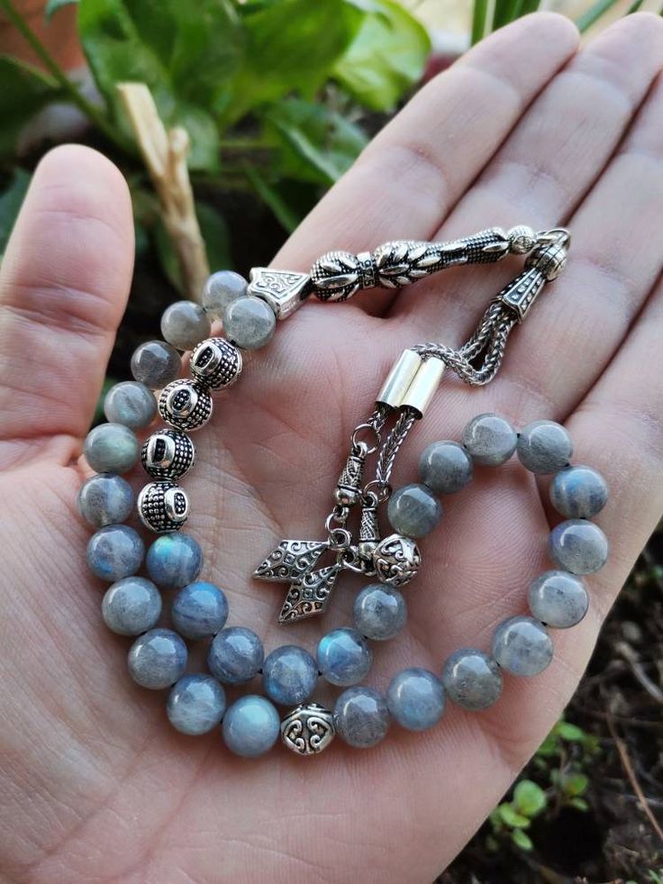 ✔️ This top quality personalized rosary made by using 8 mm round cut, AAA grade labradorite stone beads. ✔️ Natural Stone Tasbeeh ✔️ Natural Color Labradorite Misbaha ✔️ This customized tasbih is a very special gift for your loved ones. ✔️ Each order comes in a special box. ✔️ PLEASE CLICK THE LINK FOR ALL PRAYER BEADS MODELS https://www.etsy.com/shop/GoodJewelsofYazmasal Note: As a natural feature the stones beads may have some variations. SHIPPING: United States (Standart/DHL eCommerce/usps): Silver Rosary With Round Beads For Meditation, Adjustable Silver Rosary For Meditation, Polished Round Beads Rosary As Gift, Round Polished Bead Rosary As Gift, Silver Spiritual Rosary Bracelet With Gemstone Beads, Silver Beaded Rosary For Meditation, Polished Round Beads Rosary For Jewelry Making, Spiritual Round Beads Rosary For Jewelry Making, Adjustable Polished Beads Rosary For Meditation