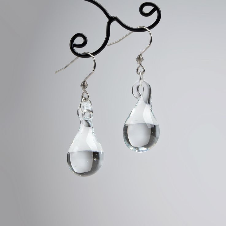 "These Clear teardrop earrings are made of glass in lampwork technique. The stainless steel hooks are hypoallergenic. They will not tarnish, fade, or discolor with time. These unique and beautiful earrings are like water drops frozen in glass! They are simple and elegant, very lightweight and comfortable to wear, perfect for everyday wear and for special occasions. You will definitely receive lots of compliments on your new earrings, everybody loves them, and you'll love them too! Dimensions: to Minimalist Teardrop Glass Jewelry, Nickel-free Glass Drop Jewelry, Glass Drop Earrings With Matching Set, Modern Glass Teardrop Earrings, Elegant Glass Drop Jewelry, Elegant Drop Glass Jewelry, Elegant Drop-shaped Glass Jewelry, Glass Teardrop Jewelry With Matching Earrings, Everyday Glass Drop Earrings