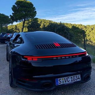 the rear end of a black sports car