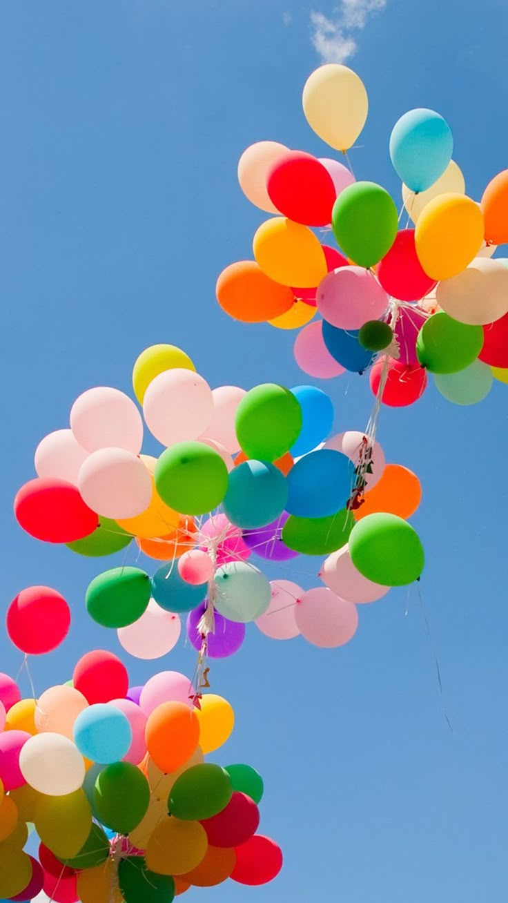 many balloons are floating in the air