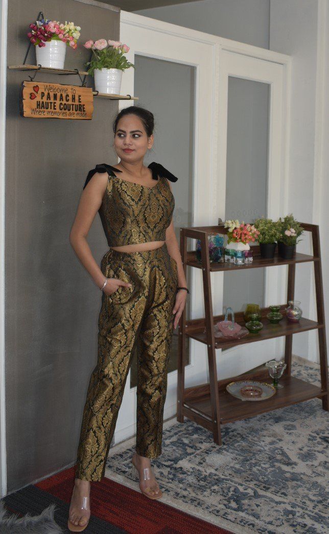 Attractive Banarasi Brocade Trouser with a Blouse Be the lively, beautiful you with an undying spirit as you wear this stylish Banarasi Brocade silk trouser set. This attire has a chic combination of trouser and a blouse with a printed panel detail, which is drool-worthy. Each piece of this outfit is crafted using the excellent quality of material that gives you a stylish and comfortable look. This attractive outfit will shower you compliments for your rich sense of style. This outfit is perfect Formal Festive Set With Unstitched Blouse, Elegant Unstitched Silk Blouse Set, Elegant Silk Unstitched Blouse Set, Elegant Festive Palazzo Set With Unstitched Blouse, Festive Elegant Palazzo Set With Unstitched Blouse, Elegant Silk Set With Unstitched Blouse, Formal Sets For Navratri, Festive Raw Silk Evening Set, Elegant Silk Palazzo Set With Unstitched Blouse