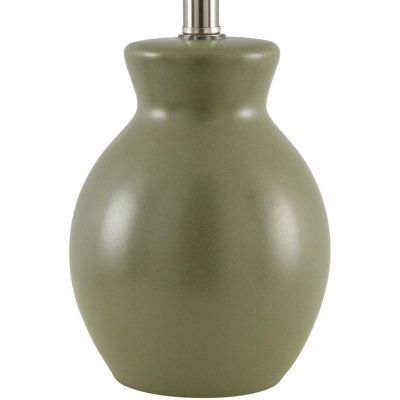 an olive green vase with a silver faucet on the top is shown in front of a white background