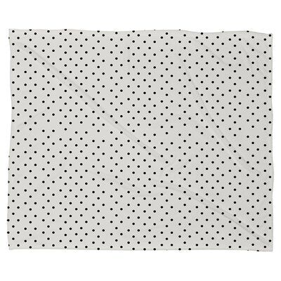 a white and black polka dot print napkin