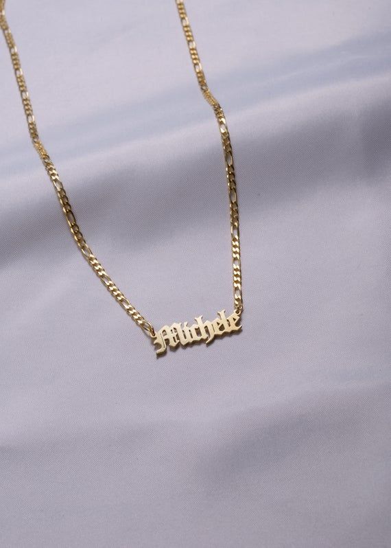 Personalized Gothic Name Necklace , Dainty Gothic Name Necklace Figaro Chain , Custom Old English Font Name Necklace , Mothers Gift , Mother's Day GiftsC U S T O M - NAME - N E C K L A C E- Material: Solid 925 Sterling Silver- Finish : Sterling Silver - Gold Filled - Rose Gold Filled* All our jewelries are handcrafted at our workshop.H O W - T O - O R D E R1- Select color and length from the menu2- Enter your preferred NAME , number , date or symbols in the order you wantHere are the symbols we Figaro Chain Nameplate Necklace As Gift, Vintage Nameplate Necklaces, Vintage Custom Name Jewelry Nameplate, Vintage Adjustable Necklaces For Personalized Gifts, Vintage Personalized Nameplate Necklace, Vintage Custom Name Nameplate Jewelry, Personalized Vintage Nameplate Necklace, Vintage Custom Nameplate Jewelry, Vintage Gold Name Necklace