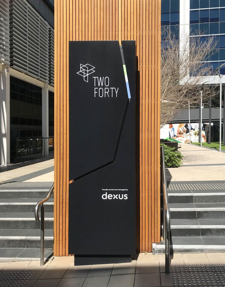 a large black box sitting on the side of a building next to some stairs and steps