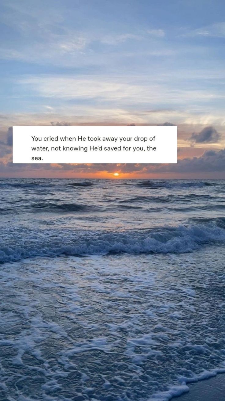 the sun is setting over the ocean with a quote on it