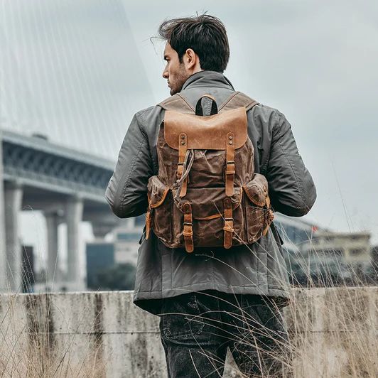 Genuine Leather & Canvas Vintage Backpack — More than a backpack Rugged Leather Backpack For Outdoor Activities, Brown Backpack With Multiple Pockets For Outdoor, Brown Backpack With Leather Handles For Outdoor, Brown Outdoor Backpack With Multiple Pockets, Brown Outdoor Backpack With Leather Handles, Outdoor Large Capacity Canvas Backpack, Rugged Leather Hiking Backpack, Rugged Leather Backpack For Travel, Rugged Canvas Backpack For Outdoor