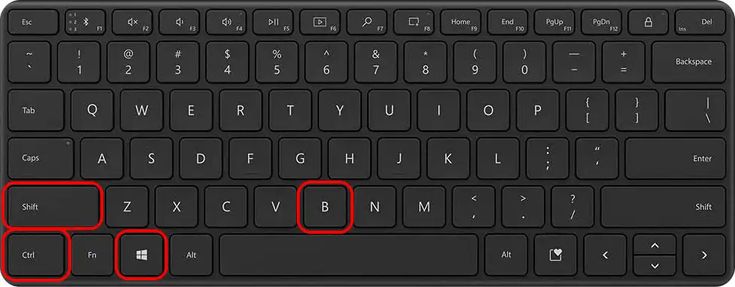 the keyboard is black and has two red squares on each side of the keypad