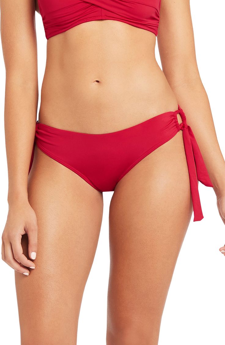 Drapey ties tether the sides of these shapely swim bottoms designed with airy ring details. Moderate back coverage Partially lined 85% recycled polyester, 15% elastane Hand wash, dry flat Imported This product meets Nordstrom Sustainably Sourced Materials criteria: contains at least 50% sustainably sourced materials Red Tie-side Pool Bottoms, Red Tie-side Bottom Beachwear, Red Tie-side Swimming Bottoms, Adjustable Straps Tie-side Swim Bottoms, Red Adjustable Tie-side Swimwear Bottom, Red Swimwear With Bra-friendly Tie-side Bottom, Stretch Red Swimwear With Built-in Bra, Red Swimwear With Built-in Bra And Stretch, Fashion Bottoms