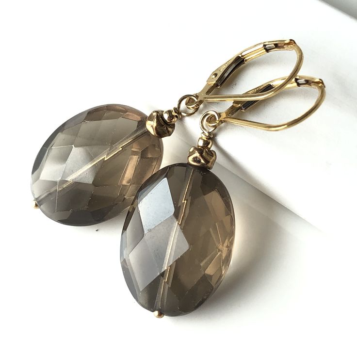 5953 Smokey Quartz Gold Filled Earrings natural gemstone bohemian statement oval dangle drops mothers day birthday or holiday gift for her mom sister wife girlfriend niece aunt grandma cousin colleague. Enjoy the beauty & power of natural gemstones - find SMOKEY QUARTZ healing properties below. THIS LISTING IS FOR THE EARRINGS ONLY Necklace shown for illustration and listed separately MATERIALS & DIMENSIONS ✦ Natural SMOKEY QUARTZ, gray brown, faceted ovals approx. 20x15mm; ✦ GOLD FILLED beads a Brown Oval Jewelry For Anniversary, Oval Brown Jewelry For Anniversary, Elegant Oval Brown Jewelry, Elegant Brown Oval Jewelry, Elegant Brown Natural Stone Jewelry, Elegant Nickel-free Oval Pendant Jewelry, Oval Pendant Jewelry Set For Anniversary, Adjustable Elegant Oval Pendant Jewelry, Brown Faceted Jewelry Gift