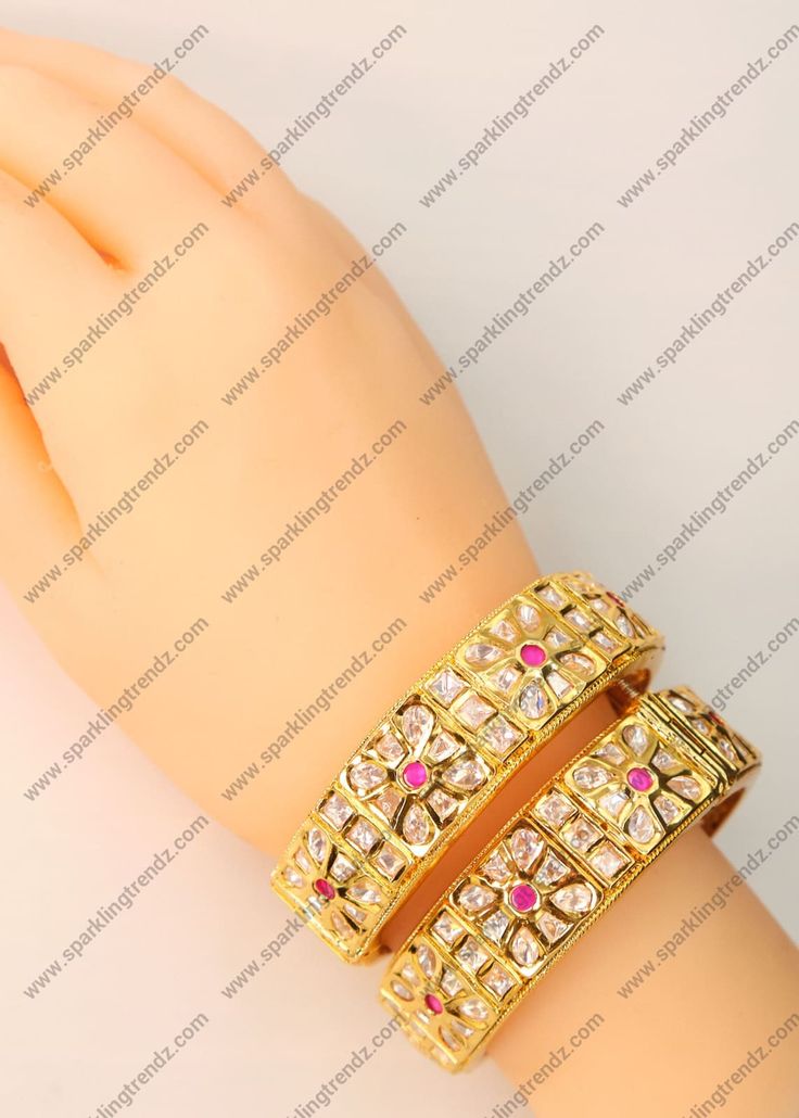 Premium Quality Uncut Kundan Openable Kada. These Kadas have a beautiful pattern of Ruby stone in the center with silver foiled uncut kundan. Simply perfect for wearing as is or in a curated bangle set. Openable Kada - You can go one size up or down. Size: 2.4 ( Diameter 5.8) Width: Approx. 0.75" Screw Opening Comes as Pair or Single 1 Gram Gold plated on high-quality brass as the base metal. *Color may vary slightly due to light condition & photography. Jewelry Care: Keep away from moisture. Al Cutdana Bracelet For Festivals, Festive Kundan Bangle With Stone Setting, Kundan Cutdana Bracelet, Fusion Style Kundan Bracelets With Cutdana, Kundan Jewelry Bracelet For Puja, Kundan Bracelets For Puja, Ceremonial Cut Dana Jewelry For Diwali, Traditional Bracelets With Stone Setting For Festive Season, Traditional Stone Setting Bracelets For Festive Season