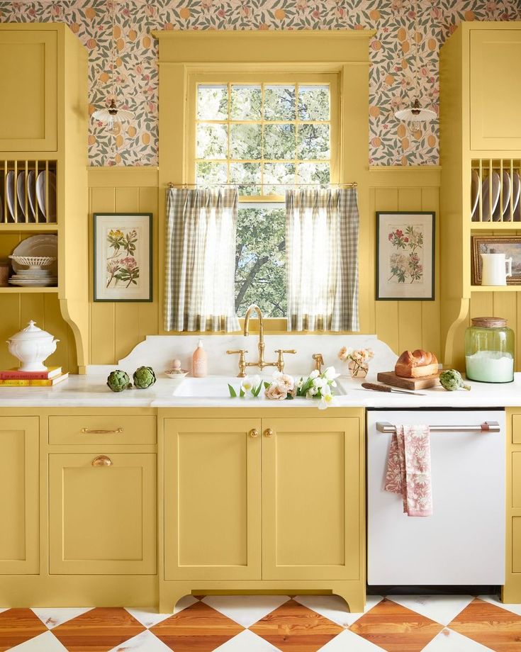 a kitchen with yellow cabinets and white appliances