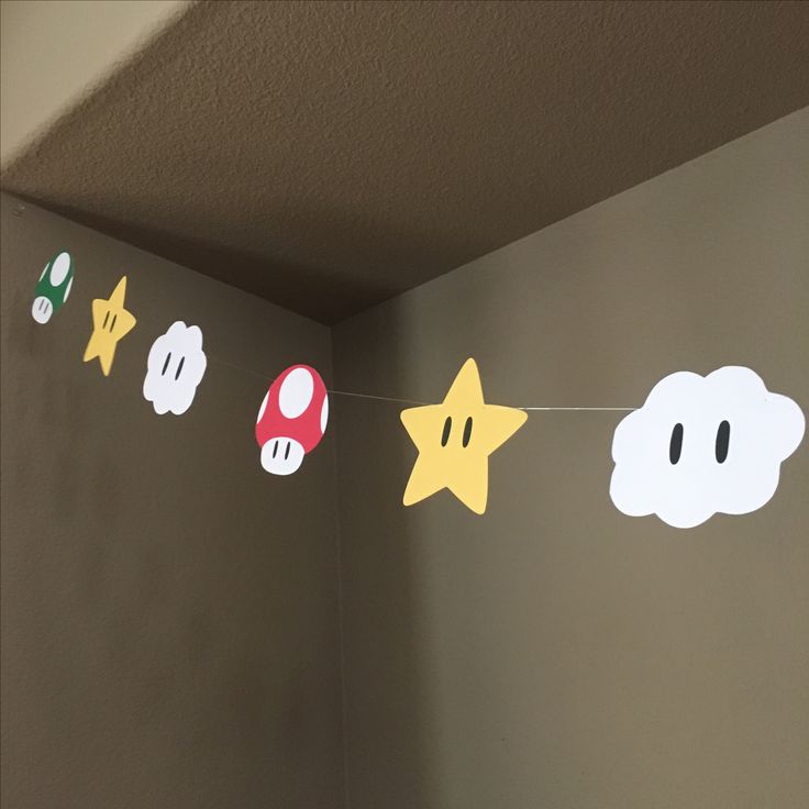 some paper mario bros decorations are hanging from the ceiling