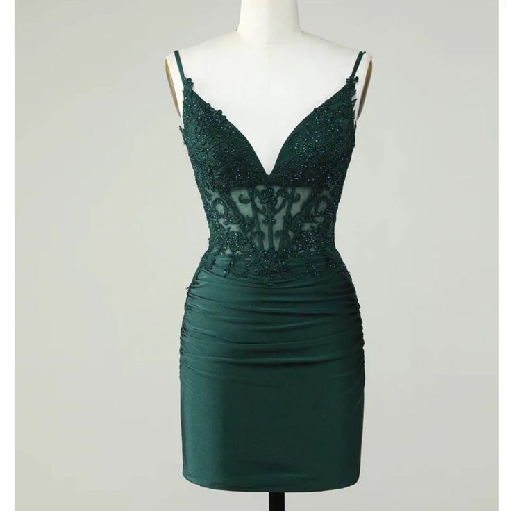 Berlinnova Us Dark Green/ Emerald Homecoming Dress With An Open Back. It Is A Corset Top With Lace And A Bottom Satin Material. It Is Size 12, Unworn/Never Used Green Cocktail Dress With Sweetheart Neckline, Green Cocktail Evening Dress With Sweetheart Neckline, Elegant Fitted Dark Green Mini Dress, Green Spaghetti Strap Evening Dress For Prom, Green Mini Dress With Fitted Bodice For Prom, Green Fitted Evening Dress With Spaghetti Straps, Fitted Green Evening Dress With Spaghetti Straps, Green Evening Dress With Spaghetti Straps, Fitted Dark Green Cocktail Dress