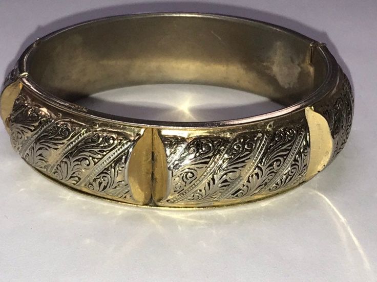 "VINTAGE Fancy Sterling Silver Gold Vermeil 3/4\" Wide Bangle Bracelet! A very pretty bracelet! Fancy gold vermeil wide bangle bracelet. Shows some wear from age but very nice! 7\" inside measurement 3/4\" wide. Weighs 30.8 grams It will look beautiful on any one who wears it! Please message me with any questions Shipped insured/delivery confirmation I guarantee item to be exactly as described and pictured." Vintage Yellow Gold Bangle Cuff Bracelet, Vintage Yellow Gold Bangle, Vintage Yellow Gold Cuff Bracelet With Intricate Design, Victorian Gold Bangle Cuff Bracelet, Vintage Yellow Gold Cuff Bracelet For Ceremonial Occasions, Vintage Hinged Cuff Bracelet, Victorian Gold Bangle For Weddings, Vintage Gold Bracelet For Wedding, Victorian Gold Hinged Bangle