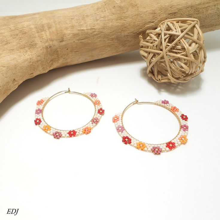 ** Hoop earrings Miyuki beads woven flowers pearly white gold red orange mauve ** Flower style woven miyuki bead hoop earrings, pearly white, gold, red, orange, mauve and pink miyuki beads. Long: approx. 4 cm, diameter: 4.5 cm Gold metal hoop holders guaranteed nickel-free. Very light to wear. Hand-woven jewelry, French designer. Delivered with its small organza, fabric or velvet pouch and carefully packaged. Coordinated woven cuff bracelet in store. Handmade Delicate Flower Hoop Earrings, Handmade Hoop Flower Earrings For Gift, Summer Hoop Earrings With Tiny Beads For Gift, Handmade White Hoop Flower Earrings, Summer Gift Hoop Earrings With Tiny Beads, Handmade White Flower Hoop Earrings, Delicate Handmade Flower Earrings For Summer, Delicate Handmade White Hoop Earrings, Handmade Delicate Hoop Earrings