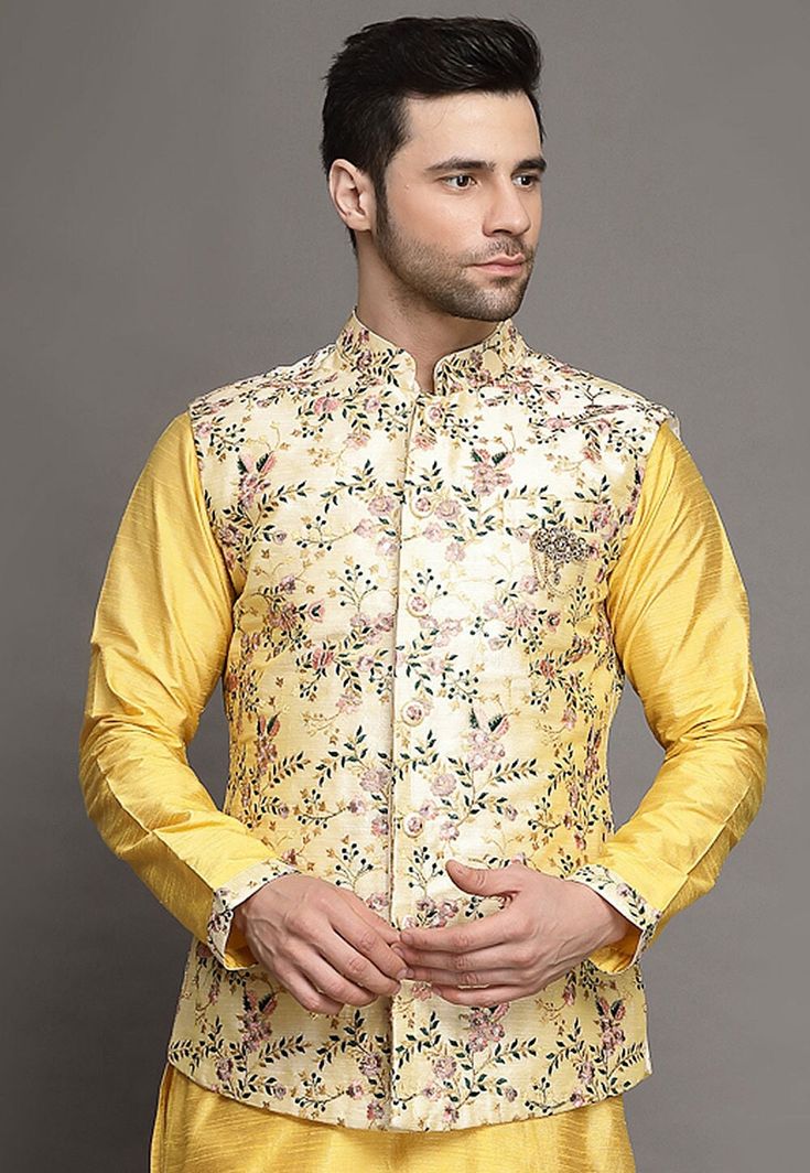 Art Silk Nehru Jacket in CreamThis Readymade Sleeveless attire is Enhanced with Buttons, Resham and Zari Work. Crafted in Chinese Collar NeckDo note: Brooch and Kurta shown in the image is for presentation purposes only. Half to one inch may vary in measurement. (Slight variation in actual color vs. image is possible) We sell all kinds of menswear. Mens Kurta | Mens Kurta Pajama | Mens Sherwani | Mens Sherwani Sets | Traditional Menswear | Partywear Menswear | Indian Mens Dresses | Diwali Kurta Spring Chanderi Nehru Jacket With Resham Embroidery, Spring Resham Embroidery Chanderi Nehru Jacket, Spring Nehru Jacket With Resham Embroidery In Chanderi, Sleeveless Nehru Jacket With Resham Embroidery For Eid, Spring Wedding Chanderi Bandhgala, Spring Wedding Bandhgala In Chanderi, Sleeveless Nehru Jacket With Zari Work For Transitional Season, Spring Wedding Nehru Jacket In Chanderi, Bollywood Style Floral Embroidered Chanderi Nehru Jacket