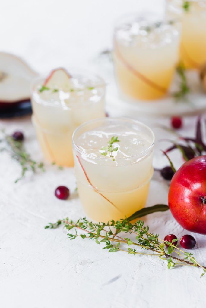 three wine glasses filled with champagne and strawberries