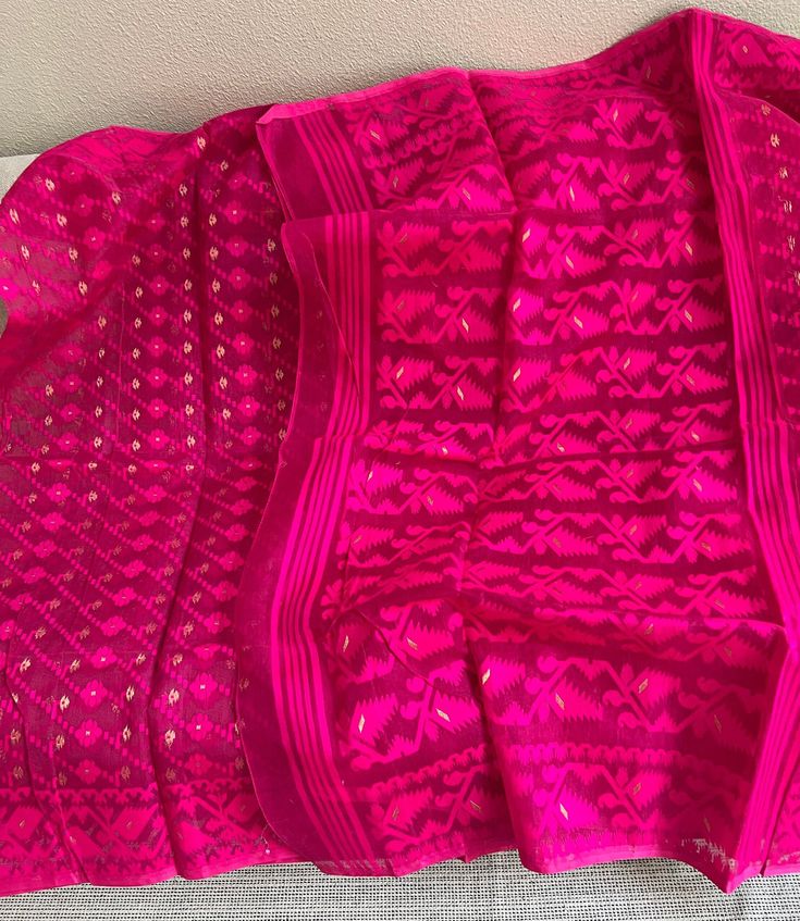 🌺Fabric- semi muslin  🌺color rani pink 🌺pattern - all over dhakai jamdani work  🌺blouse piece-no, jamdani saree comes without blouse piece. 🌺saree is ready with fall and pico if you have any questions regarding the product please contact us. Unstitched Pink Handloom Blouse Piece, Pink Semi-stitched Handloom Pre-draped Saree, Pink Kurta With Zari Weaving In Traditional Drape, Pink Bollywood Handloom Pre-draped Saree, Bollywood Style Pink Handloom Pre-draped Saree, Traditional Pink Semi-stitched Pre-draped Saree, Pink Bollywood Style Pre-draped Handloom Saree, Pink Zari Weaving Kurta For Diwali, Pink Zari Weave Kurta For Festive Occasions