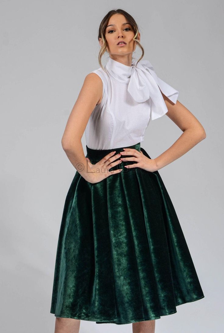 This green velvet circle skirt is a must-have for any woman's wardrobe. It's made from 100% cotton, so it's both soft and elegant. The skirt has a high waist and a full circle skirt, which gives it a flattering and feminine look. The skirt is also lined, so it's comfortable to wear. This skirt is perfect for any occasion, from a night out to a special event. It can be dressed up or down, depending on the occasion. The green color is versatile and can be paired with a variety of tops and accessor Elegant Green Mini Skirt For Party, Green Knee-length Party Skirt, Green Knee-length Skirt For Party, Green Flowy Party Skirt, Green Flowy Skirt For Party, Elegant Green Flared Mini Skirt, Elegant Green Lined Mini Skirt, Green Pleated Party Skirt, Green A-line Skirt For Party