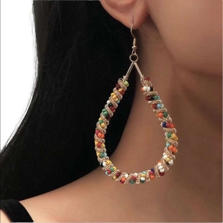 Boho Beaded Teardrop Earrings. Various Colored Glass Beads With Gold Tone Twisted Wire Accents. A Very Neat Pair Of Earrings To Go With Lots Of Outfits! Nwot! Multicolor Wire Wrapped Dangle Beaded Earrings, Party Beaded Hoop Earrings With Round Beads, Party Hoop Earrings With Round Beaded Details, Multicolor Wire Wrapped Beaded Earrings, Multicolor Teardrop Earrings For Party, Trendy Multicolor Teardrop Jewelry, Elegant Multicolor Teardrop Hoop Earrings, Summer Metal Beaded Earrings For Pierced Ears, Beaded Teardrop Earrings For Summer