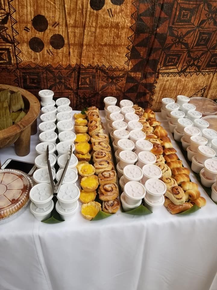 a table topped with lots of different types of food and utensils on top of it