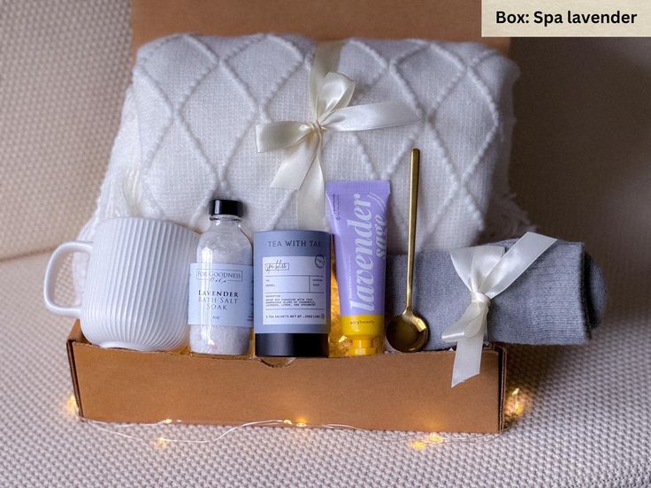 an open box containing bath products and candles