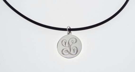 This elegant necklace is sure to bring you many compliments !  I will carefully engrave a single, beautifully ornate script initial on this high polish 7/8" diameter sterling silver disc.  Take a look at the last picture - I have engraved a sample of each letter, so you can see what yours will look like! This lovely necklace is suitable for every day wear or formal events.The finished piece will be suspended on your choice of:*16" rubber cord with stainless steel lobster clasp or*18" rubber cord Engraved Circular Jewelry Gift, Etched Necklaces For Anniversary, Etched Round Disc Jewelry As Gift, Etched Necklace For Anniversary, Etched Round Necklace For Anniversary, Elegant Etched Round Disc Necklace, Etched White Gold Round Pendant Necklace, White Gold Etched Round Pendant Necklace, Etched Medallion Necklace For Anniversary