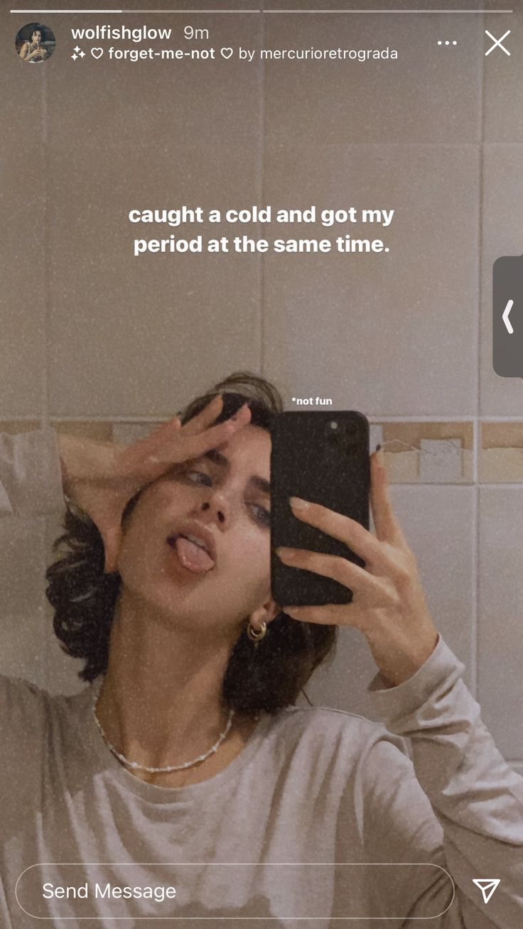 a woman taking a selfie with her cell phone in front of her face and the caption says, caught a cold and got my period at the same time