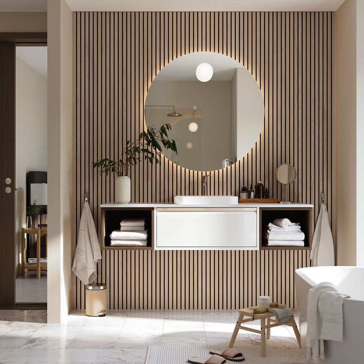 a bathroom with a sink, mirror and bathtub in it's center area