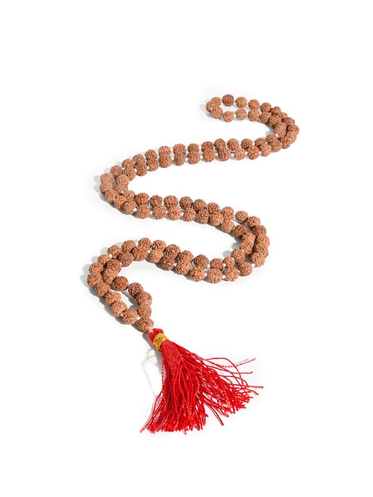 This set of Prayer Beads, a Mala or Rosary, is made of finely selected, peppercorn sized, five Mukhi Rudraksha mala beads. Thread-knotted in traditional style with red tassel, this Rudraksha rosary is best for doing Japa or chanting mantras to all deities. You may keep the healing mala in your puja altar for positive vibrations or as a garland for your deity idol. You may also wear it around your neck. It is best to avoid wearing this with other Rudraksha combinations. Measures 34 inches long wh Traditional Hand Knotted Mala For Meditation, Traditional Hand Knotted Mala For Rituals, Hand-strung Red Mala As A Gift, Traditional Hand-strung Mala For Meditation, Red Hand-strung Mala As Gift, Traditional Mala For Meditation With Latkans, Wooden Beads Mala For Rituals And Festivals, Gemstone Beads Mala For Puja And Festivals, Traditional Gemstone Beads Mala For Puja