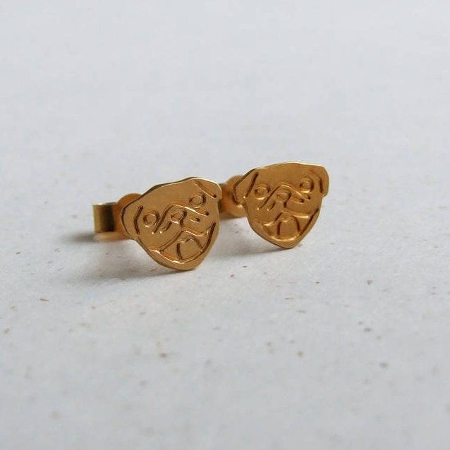 Have a little bit of cuteness on your earlobe with these 24 k Gold plated Pug stud earrings. These earrings are based on a cute pug called Lola. These earrings are handmade and then plated using 24 k Gold. The design has been etched onto the surface. The earrings have then been polished for a lovely shiny surface. They are approx 9mm tall.  All items come gift wrapped in a white box with matching pug ribbon so make a wonderful gift for a pug or dog lover. There are 7 designs in this collection: Pug Earrings, Pug Jewelry, Pug Gifts, A Pug, White Box, Gold Plated Earrings, Gold Plated Jewelry, Jewelry Plate, Yellow Gold Rings