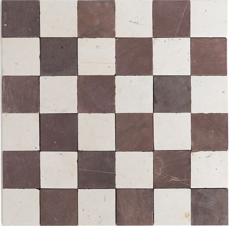 a white and brown checkerboard pattern is shown in this tile design that looks like it's made out of marble