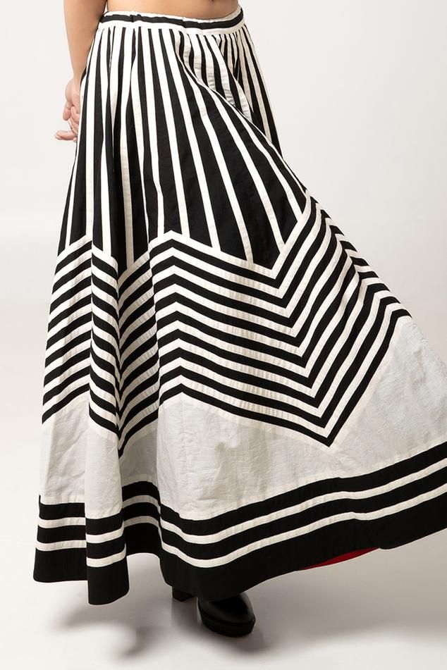 Monochrome flared midi skirt featuring striped applique work in cotton fabric, Fit: Relaxed Chic Full Skirt In Striped Color, Chic Skirt With Striped Hem And Relaxed Fit, Chic Relaxed Skirt With Striped Hem, Relaxed Skirt With Striped Hem, Black Skirt With Vertical Stripes For Summer, Chic A-line Cotton Maxi Skirt, Chic Cotton A-line Maxi Skirt, Chic Long Striped Skirt, Chic Striped Full Skirt