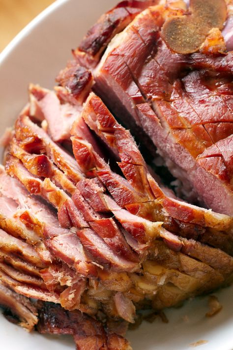 sliced ham sitting on top of a white plate