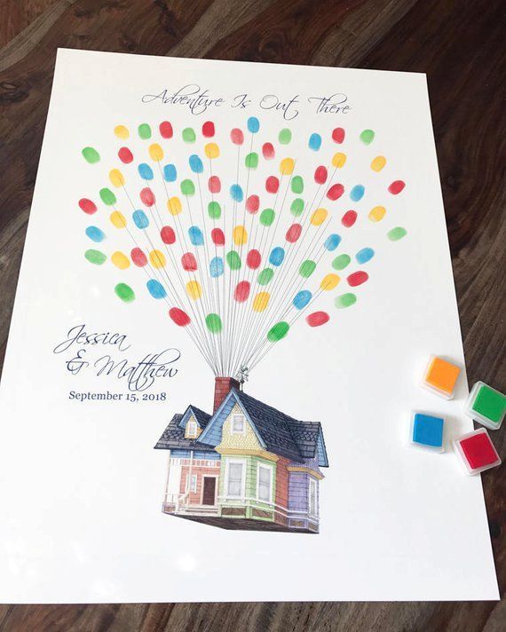 a wedding card with a house and balloons in the shape of a family's house