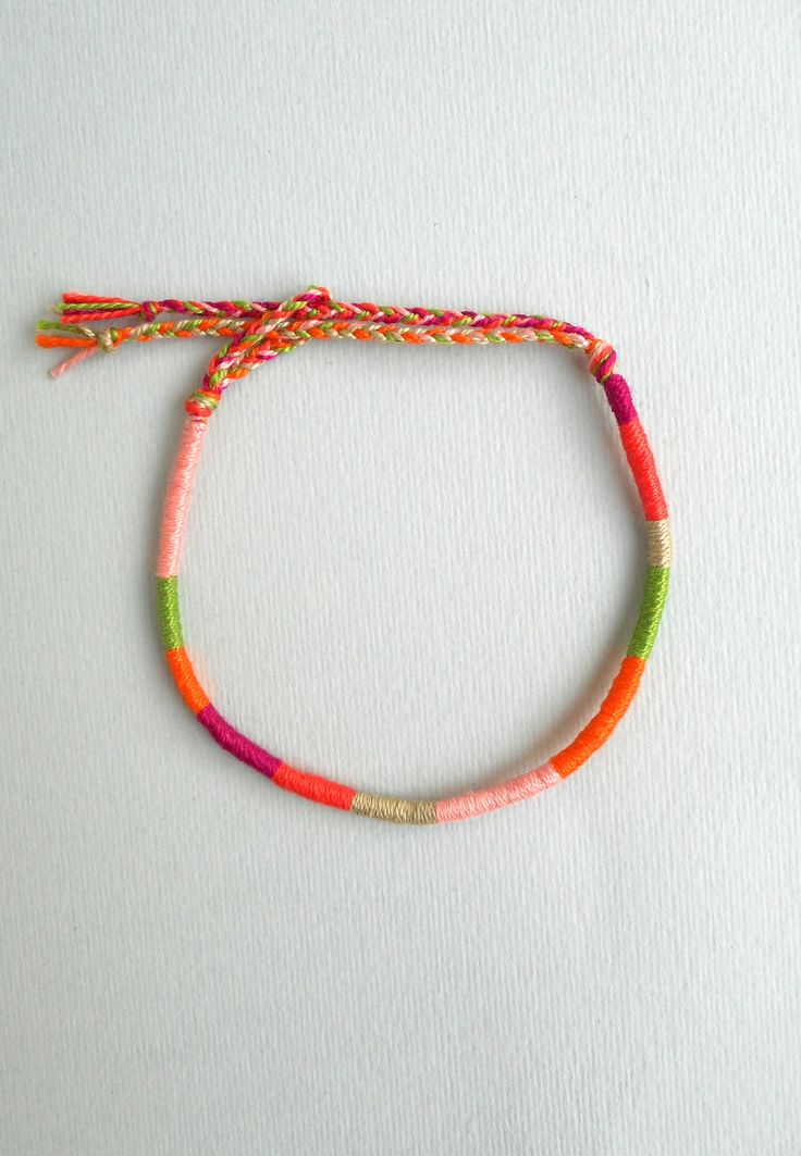 Thin friendship bracelet, Cotton thread, Wrapped bracelet Wrist stacks Earthy Best friend Colorful This wrapped bracelet is made out of 6 different colours of cotton thread It has a tie knot closure and is ended with two braids in order to fit a lot of sizes. Thickness: 0,4cm Similar wrapped bracelets in my shop: https://www.etsy.com/listing/462500661/pastel-friendship-braceletcotton?ref=listing-shop-header-0 More friendship bracelets in my shop: https://www.etsy.com/shop/LuckyRatJewellery?secti Pink Friendship Bracelet, Thread Wrapped Bracelets, Yarn Friendship Bracelets, Bracelet Cotton, Bracelet Board, Wrapped Bracelets, Yarn Bracelets, Homemade Bracelets, Wrist Stacks