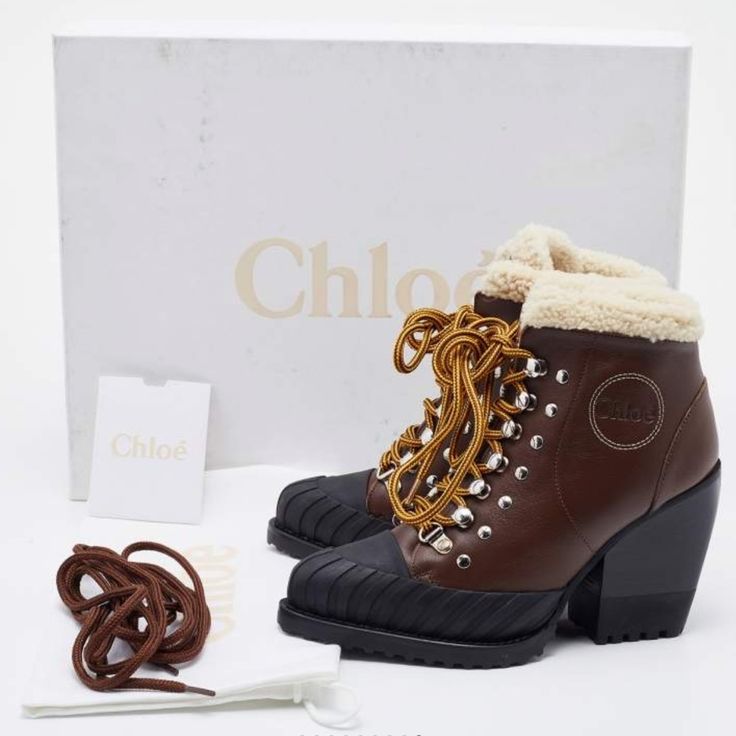 Brand New! Chloe Boots In Brown And Black. Meticulously Designed Into A Smart Silhouette, These Boots Are On-Point With Style. They Come With Comfortable Insoles And Durable Outsoles To Last You Forever. These Boots Are Just Amazing Includes: Original Dustbag, Original Box, Extra Lace Size: It 39 Exterior Material: Leather, Rubber Lining Material: Fur Insole Material: Shearling Fur Sole Material: Rubber Hardware: Silver Tone Closure Type: Lace Up Heel Size: 9.5 Cm / 3,5 Inches Made In Italy Winter Ankle Lace-up Boots In Calf Leather, Winter Boots With Padded Heel In Calf Leather, Winter Calf Leather Ankle Lace-up Boots, Winter Ankle Lace-up Calf Leather Boots, Ankle Lace-up Calf Leather Boots For Winter, Designer Winter Round Toe Heeled Boots, Winter Lace-up Boots With Reinforced Heel In Calf Leather, Winter Ankle-high Calf Leather Heeled Boots, Designer High Heel Boots For Winter