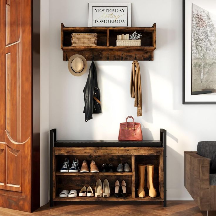 a coat rack with shoes and purses on it in front of a wooden door