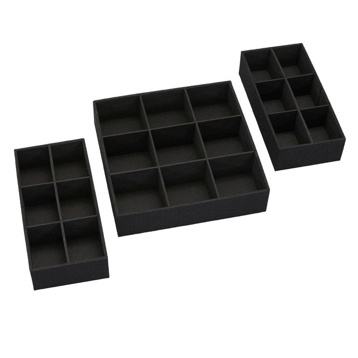 three black foam trays sitting next to each other