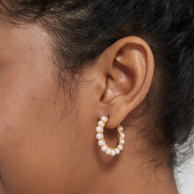 Elegant, timeless and beautiful — House of Pearls’ Circle Pearl Earrings are the perfect way to add a touch of sophistication to your formal look. Crafted with a timeless gold vermeil finish, these earrings feature a perfect circle of lustrous pearls that shimmer gracefully in the light. Whether you wear them with casual wear or a special occasion look, these earrings add a touch of poise to any ensemble. Details: Style ADiameter: 2.8cm Weight: 2.5g per earring Style BDiameter: 3.5cm Weight: 9.6 Chic Small Hoop Earrings For Anniversary, Classic Circle Hypoallergenic Earrings, Classic Hypoallergenic Circle Earrings, Classic Hypoallergenic Circular Earrings, Elegant Gold Plated Round Hoop Earrings, Elegant Gold-plated Round Hoop Earrings, Timeless Gold Round Pearl Earrings, Fine Jewelry Pearl Drop Hoop Earrings, Minimalist Hoop Pearl Earrings For Formal Occasions