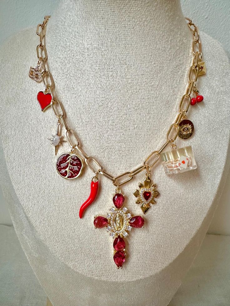 i've made the perfect piece of jewelry for you: an awesome 18-karat gold-plated necklace with a mix of 11 red & gold charms! the fine gold plating gives it a beautiful shine that perfectly matches to you. each of the 11 charms is a little work of art, and together they create an awesome composition. i'm sure you'll love this necklace. it's a little red fire that will bring you strength and romantic every day - just like the color red. love, lena from loony you length: 39 cm, extendable to 43 cm Luxury Vintage Red Necklaces, Gold Aesthetic Clothes, Red Dangle Charm Necklaces, Red Pendant Gold-plated Jewelry, Red Pendant Jewelry In Gold Plated, Red Gold Plated Pendant Jewelry, Valentine's Day Vintage Charm Necklaces, Red Pendant Charm Necklace, Valentine's Day Gift Necklace With Vintage Charm