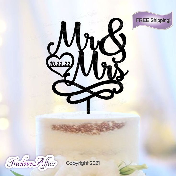 a wedding cake topper with the word mr and mrs on it, in black