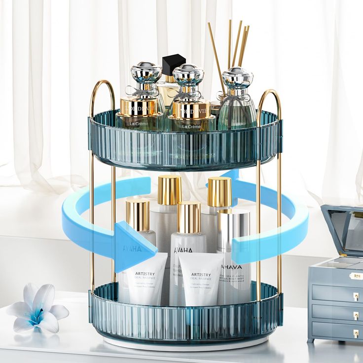 a three tiered tray with bottles and candles on it