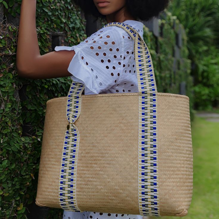 This vegan bamboo tote bag is a contemporary take on a summer favourite. Robust and lightweight in equal measure, it is handcrafted using traditional Lombokian weaving skills, offset with contemporary jacquard straps. Sling the bag over your shoulder for trips to the market and beach alike. This tote bag also comes with its own unique code, that connects you to the artisan who handcrafted it for you. Please note that Archive Sale purchases are final sale. We are unable to accept returns. Woven Beach Bags, Raffia Tote Bag, Vegan Sneakers, Vegan Boots, Vegan Leather Jacket, Medium Tote, Heeled Loafers, Pump Sandals, Jewelry Pouch