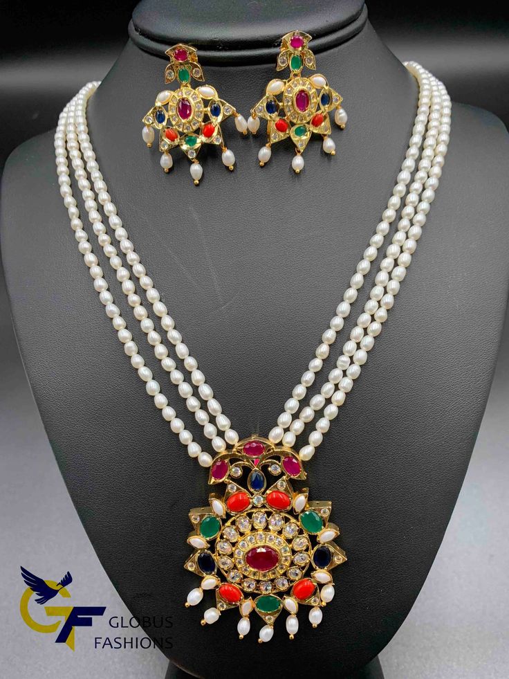 Navarthana stones pendant set with real natural pearls long chain Handmade jewelry Silver plated jewelry One gram gold jewelry jewelry Official Website globusfashions.com 🌸 S H O P . M O R E . S T Y L E S 🌸 https://www.etsy.com/shop/Globusfashions Necklaces - https://www.etsy.com/shop/Globusfashions?section_id=18712263 Bracelets - https://www.etsy.com/shop/Globusfashions?section_id=18969767 Pendant Sets - https://www.etsy.com/shop/Globusfashions?section_id=18707402 Tikka - https://www.etsy.com Multicolor Gold Plated Necklaces For Party, Multicolor Gold-plated Necklaces For Parties, Gold Pearl Necklace With Colorful Beads For Party, Party Jewelry With Pearl Pendant And Round Beads, Multicolor Jeweled Necklaces With Round Beads, Multicolor Gold Plated Jewelry For Party, Multicolor Pearl Chain Jewelry For Festivals, Multicolor Gold Plated Party Jewelry, Multicolor Pearl Chain Jewelry