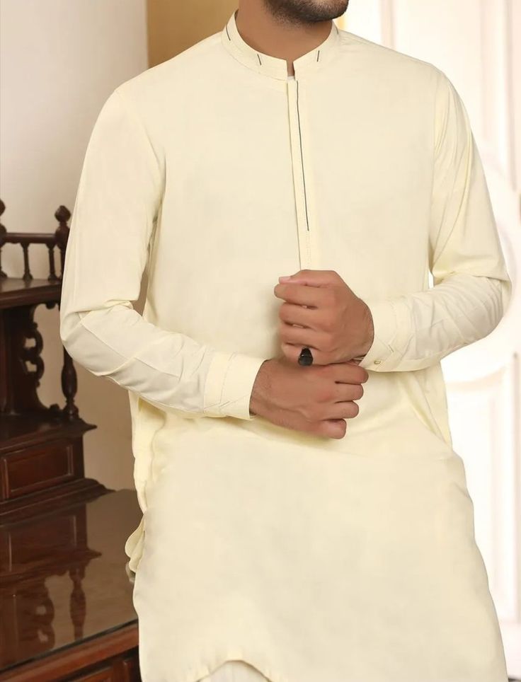 Men's Pakistani suits online for event of Eid 1 Luxury Men's Salwar Kameez For Eid, Off White Unstitched Bandhgala With Long Sleeves, Unstitched Off White Bandhgala With Long Sleeves, Cream Long Sleeve Nehru Jacket With Naqshi, Long Sleeve Cream Sherwani With Naqshi, Cream Long Sleeve Bandhgala For Eid, Long Sleeve Cotton Suits For Wedding, Unstitched Beige Suit With Naqshi Details, Beige Unstitched Suit With Naqshi Detail