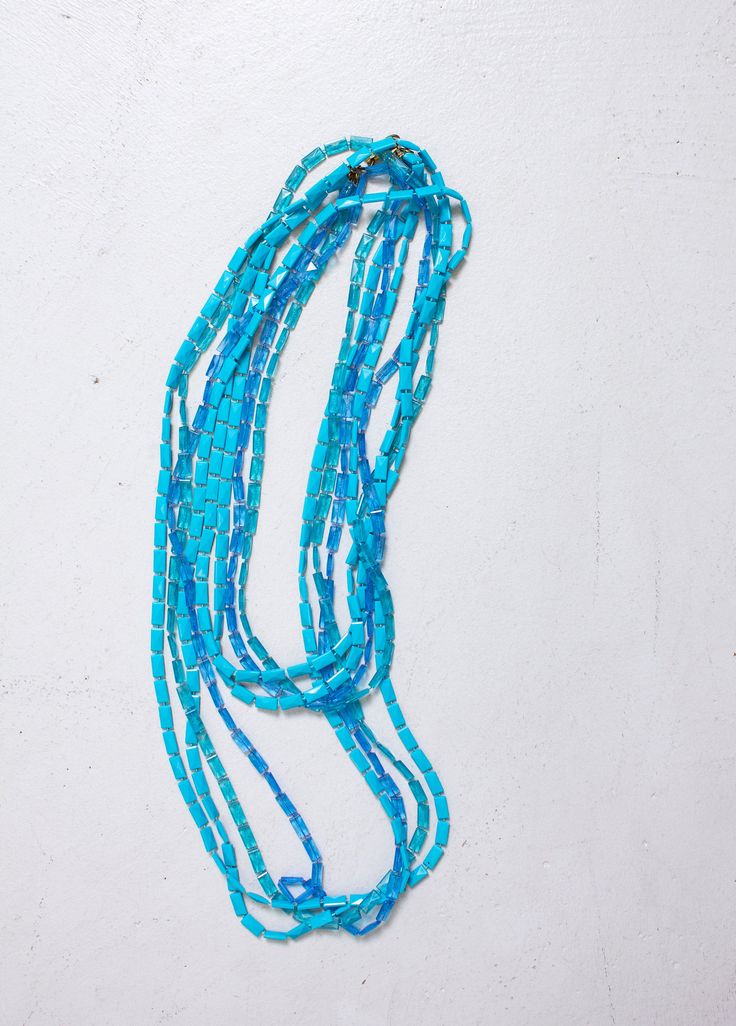 "Vintage 1960s fantastic costume necklace. 4 strands of multi colored blue plastic beaded extra long strands. Looks great doubled over of worn long. Gold tone clasp closure. Marked: none Measures 50\" total Condition: Excellent. Please do not hesitate to convo with any questions. We upload large pictures - Simply click on each picture for a closer look. More VINTAGE from DEJAVINTAGE here... http://www.etsy.com/shop/dejavintageboutique - Follow us on Instagram @dejavintage for exclusive first loo Blue Double Strand Beaded Necklaces With Colorful Beads, Blue Double Strand Beaded Necklace With Colorful Beads, Blue Double Strand Beaded Necklace For Beach, Blue Double Strand Necklace With Colorful Beads, Blue Double Strand Beaded Necklace, Blue Long Necklace With Colorful Round Beads, Vintage Double Strand Colorful Beads Necklace, Blue Long Necklace With Colorful Beads, Bohemian Blue Long Necklace With Faceted Beads